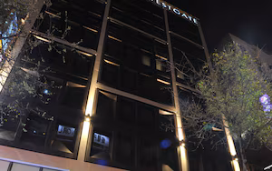 A modern building with a sign reading "WESTGATE" at the entrance.